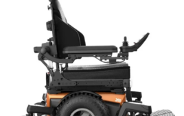 Right-side view of Magic 360 power chair with orange shroud.