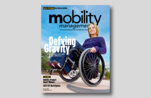 Mobility Management cover shows young woman in ultralightweight wheelchair doing a wheelie.