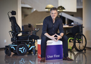 Chuck Witkowski is shown with a Permobil power chair and an ultralightweight wheelchair.