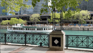 View of the Riverwalk showing a boat going by.