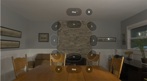 Screen capture of an Apple Vision Pro showing power wheelchair functions overlaid atop a living room view.