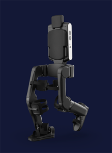 Eve exoskeleton is shown standing upright against dark blue background.